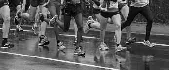 Black and white photo of runners' legs