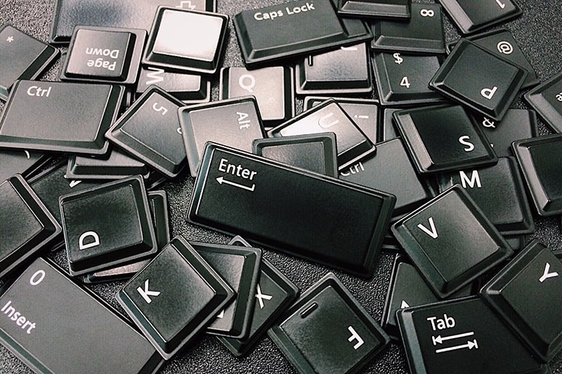 keyboard keys scattered on a table