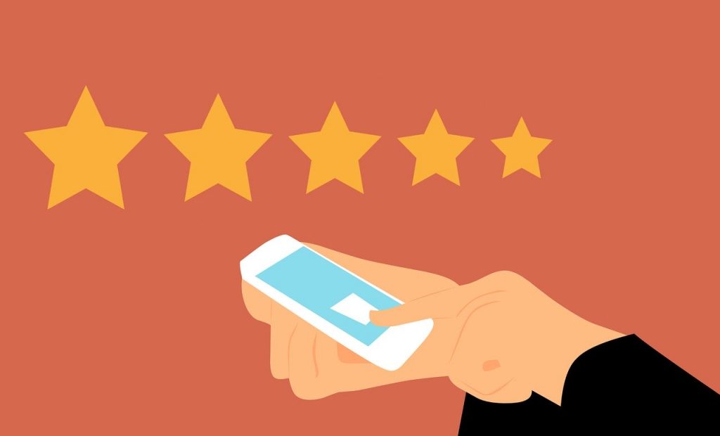 illustration of person using mobile phone with five stars above