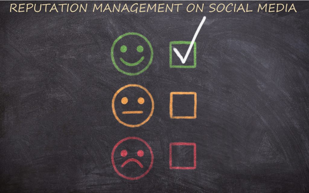 "Reputation management on social media" written on chalkboard with smiley face, neutral face, and frowning face and check mark next to smiley face